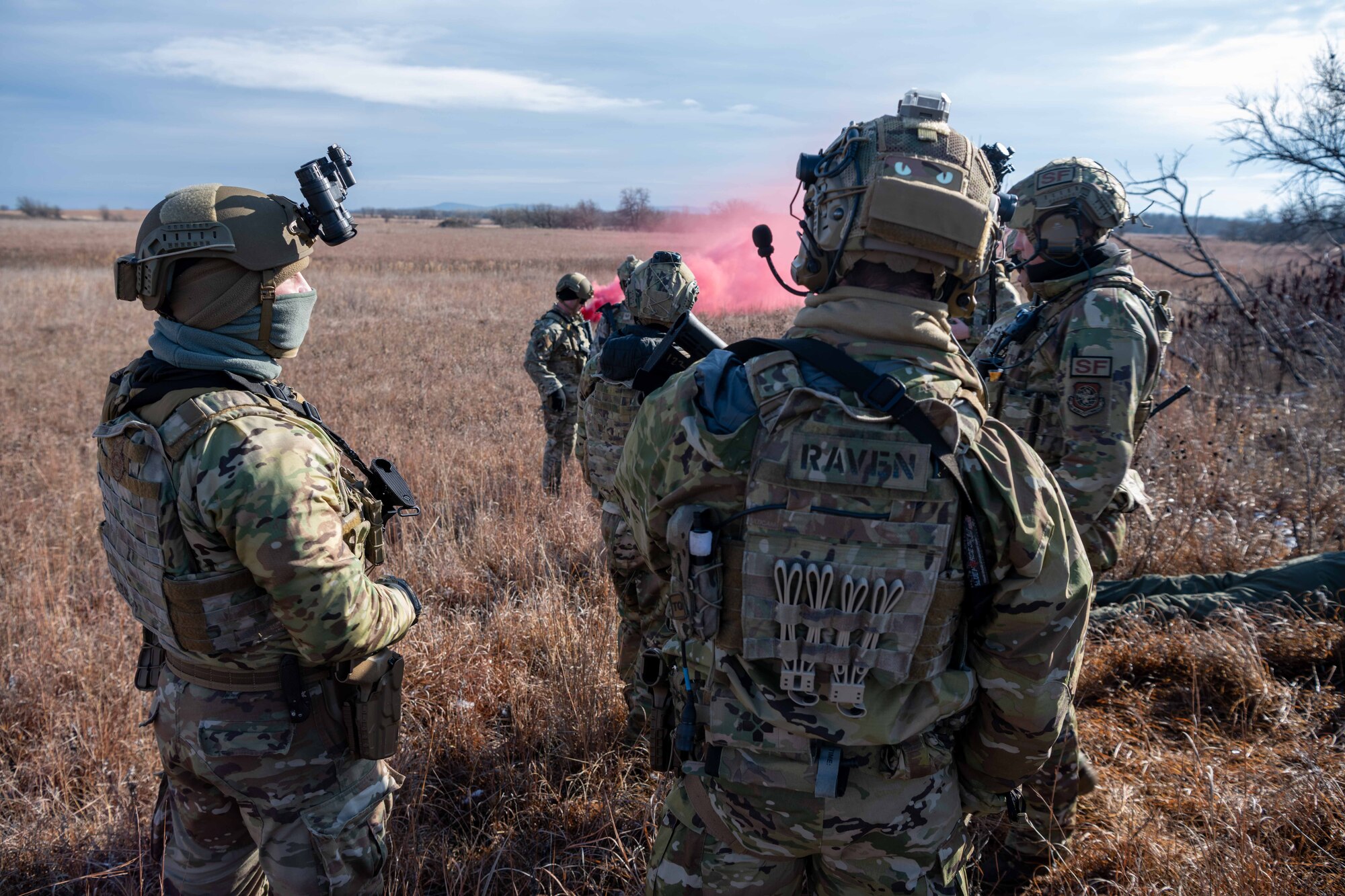Defenders from the 22nd Security Forces Squadron simulate rescuing a downed pilot during Lethal Defender Dec. 2, 2023, at Smoky Hill Air National Guard Range, Kansas. Lethal Defender is week-long training exercise that trained Defenders on all the elements to efficiently set up and maintain air bases. (U.S. Air Force photo by Airman 1st Class William Lunn)