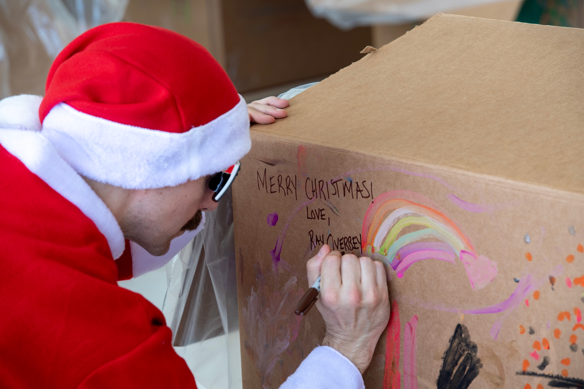 Photo of a Bundled package for Operation Christmas Drop getting signed