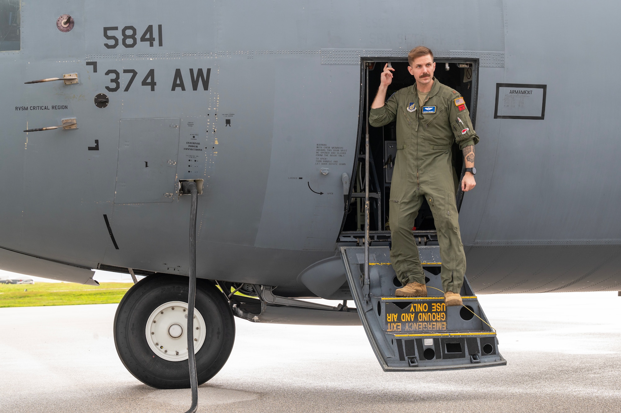 Photo of a U.S. Air Force pilot exiting a C-130J