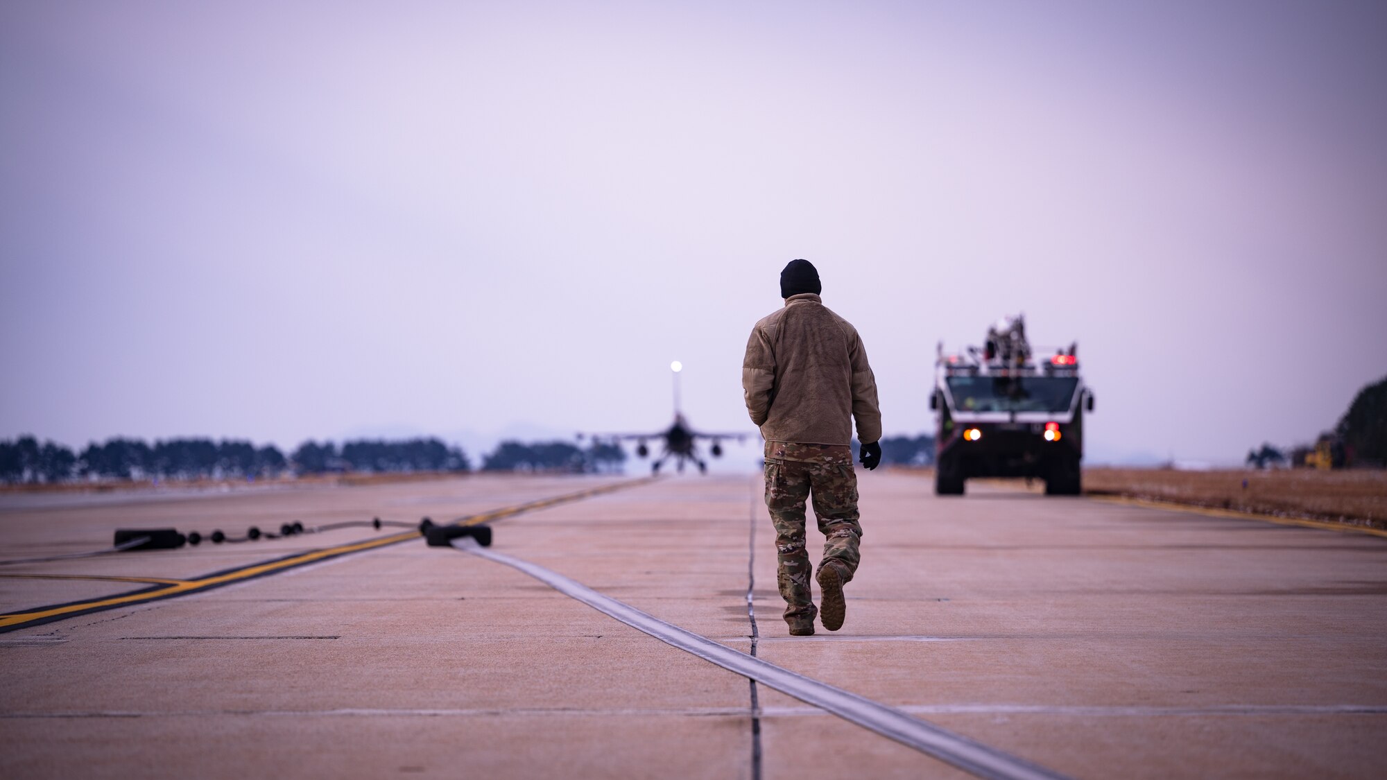 An Airman assigned to 8th Maintenance Squadron retrieves an arresting cable following a certification test at Kunsan Air Base