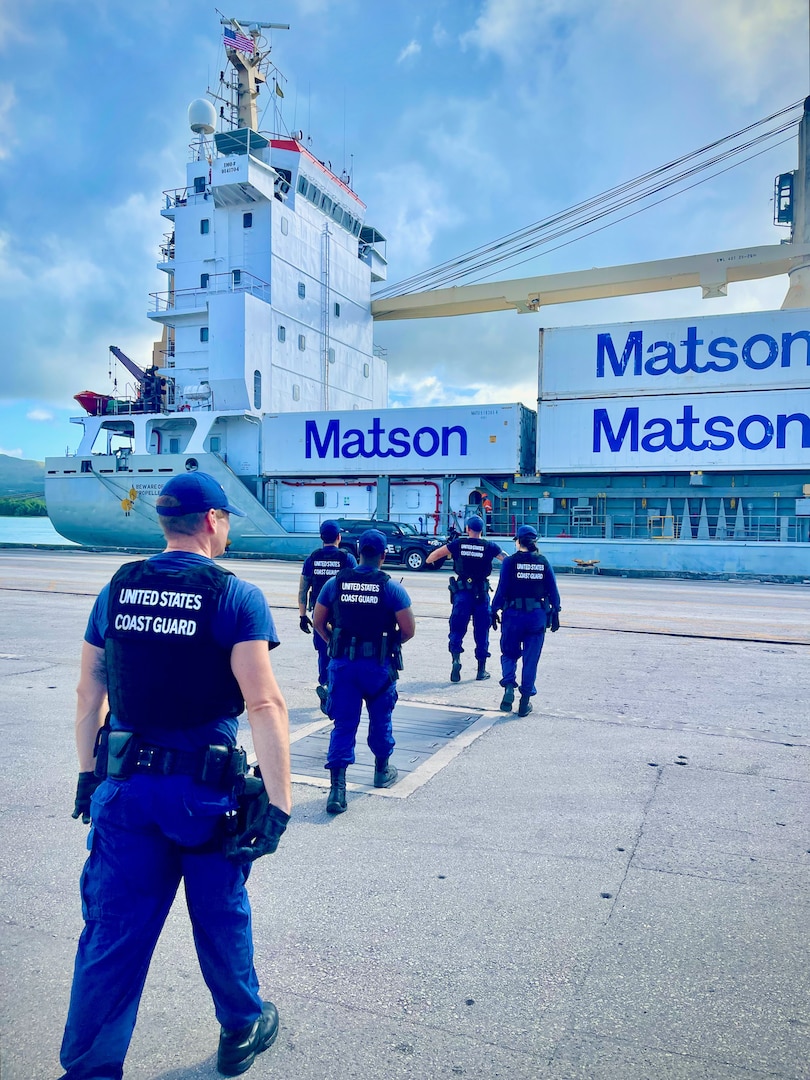 A U.S. Coast Guard Sector Boarding Team, a key component of U.S. Coast Guard Forces Micronesia/Sector Guam, conducts a thorough security boarding of the 380-foot (116-meter) motor vessel Papa Mau, flagged from Antigua Barbuda, at the Port of Guam on Dec. 6, 2023. This general cargo vessel, arriving from Pohnpei in the Federated States of Micronesia (FSM), was meticulously inspected upon reaching Guam and found to be in full compliance. (U.S. Coast Guard photo by Lt. Brian Maffucci)