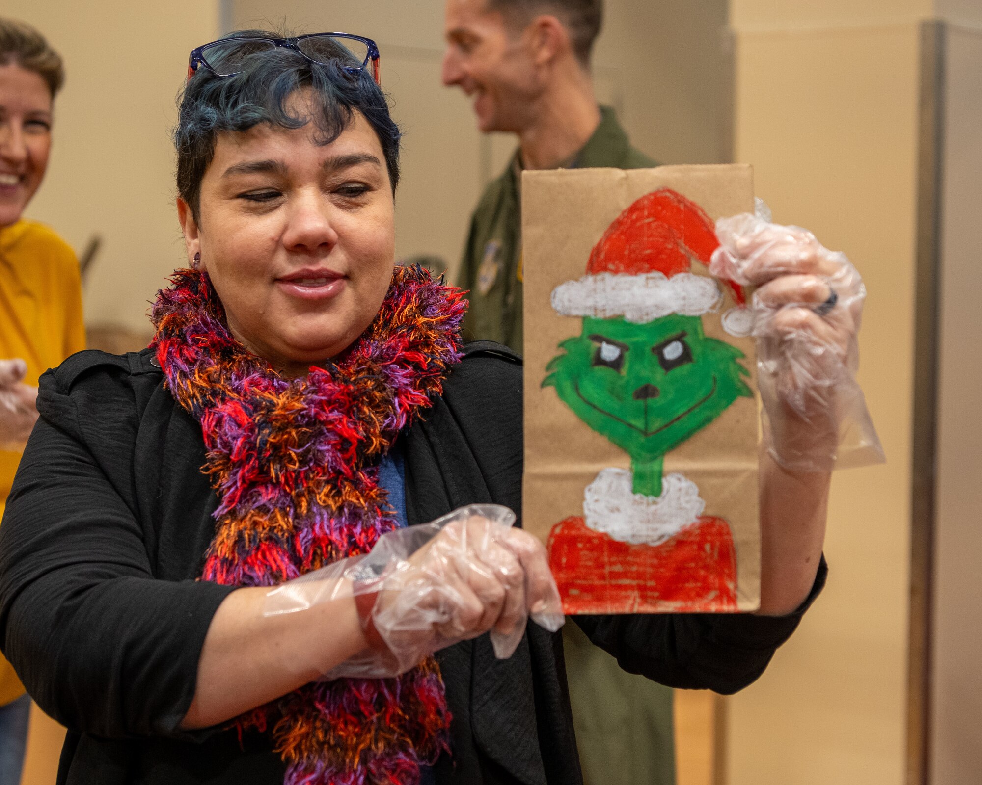 A member of Team Misawa shows off one of the custom-made bags for the annual Cookie Caper at Misawa Air Base, Japan, Dec. 5, 2023.