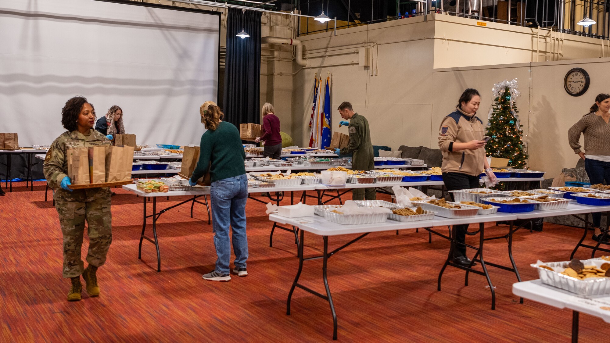 Members of Team Misawa package treats as part of the annual Cookie Caper at Misawa Air Base, Japan, Dec. 5, 2023.