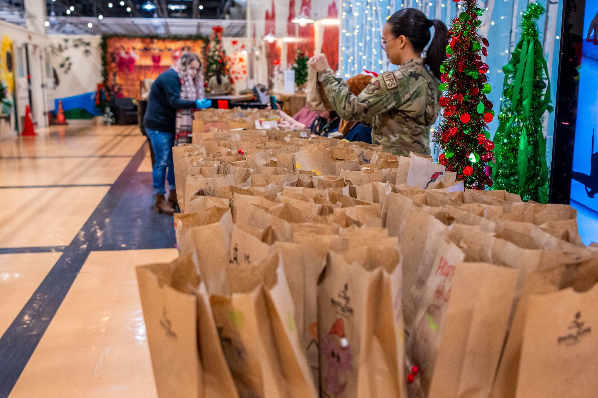 Members of Team Misawa pack cookies and treats as part of the annual Cookie Caper at Misawa Air Base, Japan, Dec. 5, 2023.