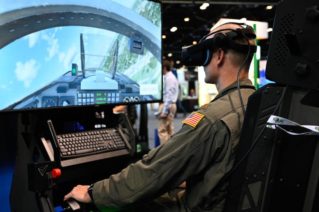 A service member  looks at a monitor  during prototype pilot training.