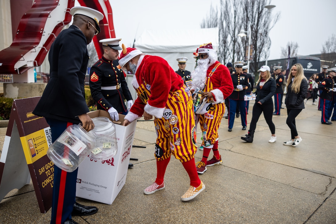 U.S. Marines with Marine Corps Base Quantico and Marine Corps Forces Reserve participate in the Toys for Tots toy drive during the Washington Commanders football game at FedEx Field, Landover, Maryland, Dec. 3, 2023. The primary goal of Marine Toys for Tots is to collect new unwrapped toys to help bring the joy of Christmas and send a message of hope to America’s less fortunate children. (U.S. Marine Corps photo by Lance Cpl. Joaquin Dela Torre)