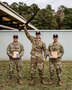 Multiple men in U.S. Army uniforms on outdoor range.