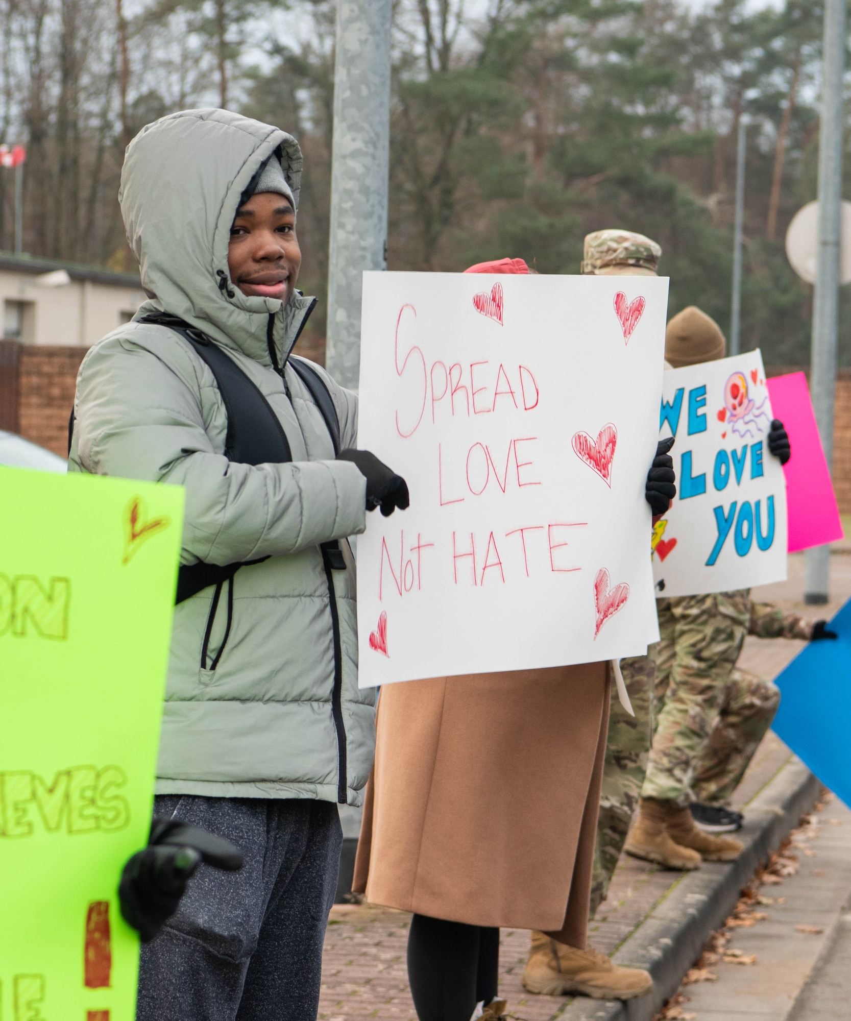 U.S. Air Force Senior Airman Lee Weathersby, 786th Force Support Squadron awards and recognition technician, holds up a sign during a “You Matter” mental health awareness campaign .