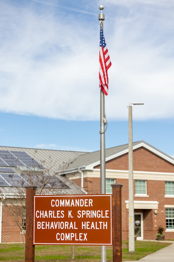 The Commander Charles K. Springle Behavioral Health Complex stands at Midway Park on Marine Corps Base Camp Lejeune, North Carolina, Dec. 4, 2023. Cmdr. Springle was killed in Iraq in 2009 after serving 21 years in the U.S. Navy as a licensed clinical social worker. In his memory, the building honors his dedication to helping fellow service members. (U.S. Marine Corps photo by Lance Cpl. Alyssa J. Deputee)