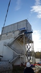 Employees at Naval Undersea Warfare Center Division, Keyport’s Acoustic Test Lab install an awning above an upper entrance to the Transducer Automated Test Facility. The awning installation serves as a prime example of operational risk management done right, according to Kip Reid, a safety specialist at the command.