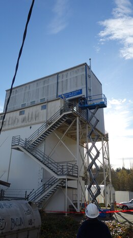 Employees at Naval Undersea Warfare Center Division, Keyport’s Acoustic Test Lab install an awning above an upper entrance to the Transducer Automated Test Facility. The awning installation serves as a prime example of operational risk management done right, according to Kip Reid, a safety specialist at the command.