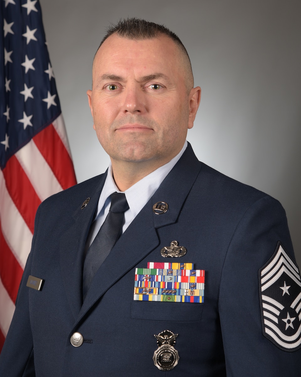 Chief Alvarez poses for an official military portrait.