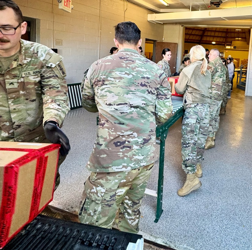 Wisconsin National Guard members unload incoming boxes of collected unwanted medications at a collection site in Waukesha, Wis., Oct. 30. There the medication was consolidated for shipment to a secure disposal site as part of Wisconsin’s Drug Take Back Day effort. Submitted photo