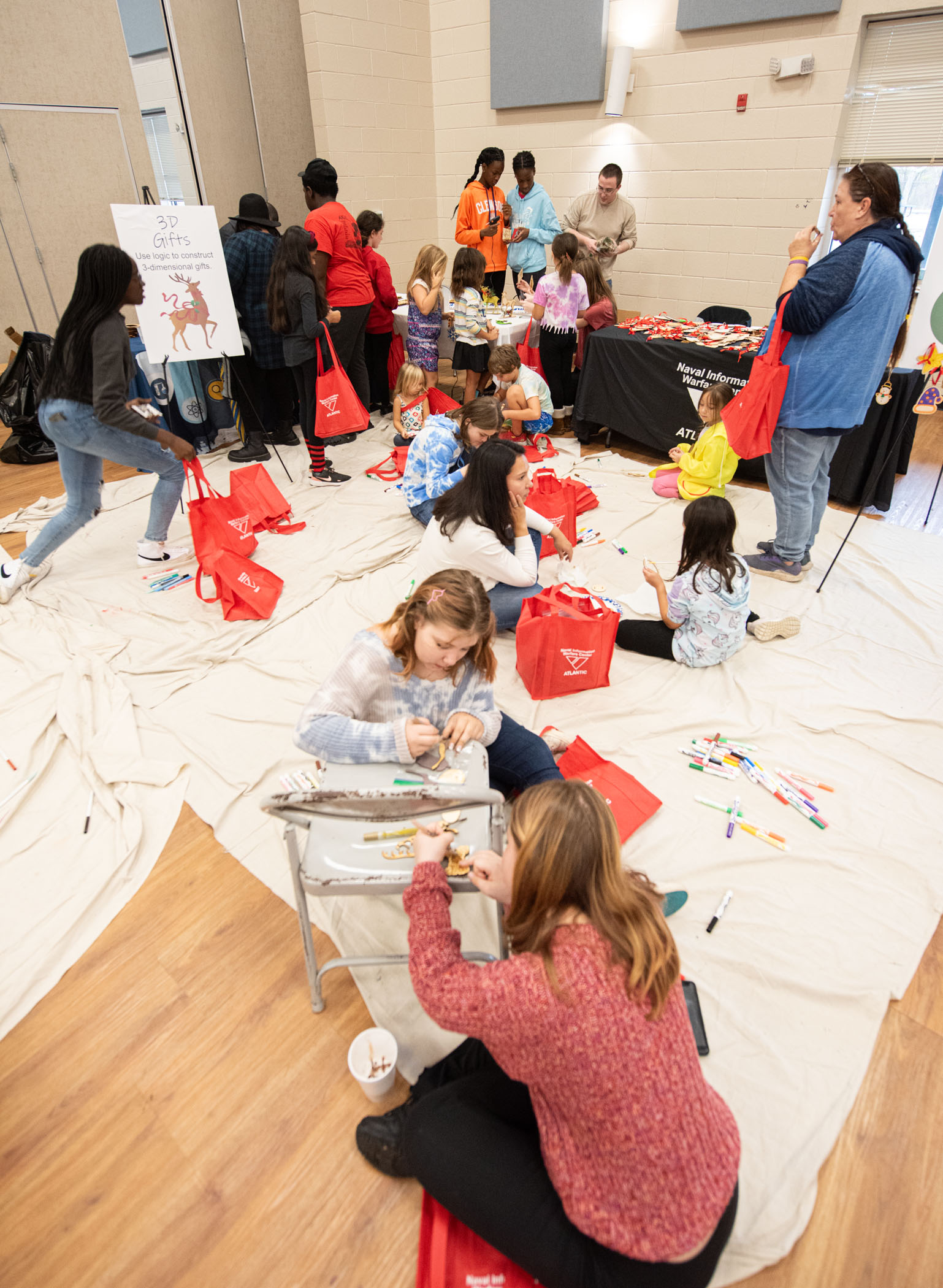 NIWC Atlantic hosts Holiday STEM Shop 2023 at Berkeley Middle School in Moncks Corner, SC on December 2, 2023.  Students use STEM to make Holiday gifts for their family.