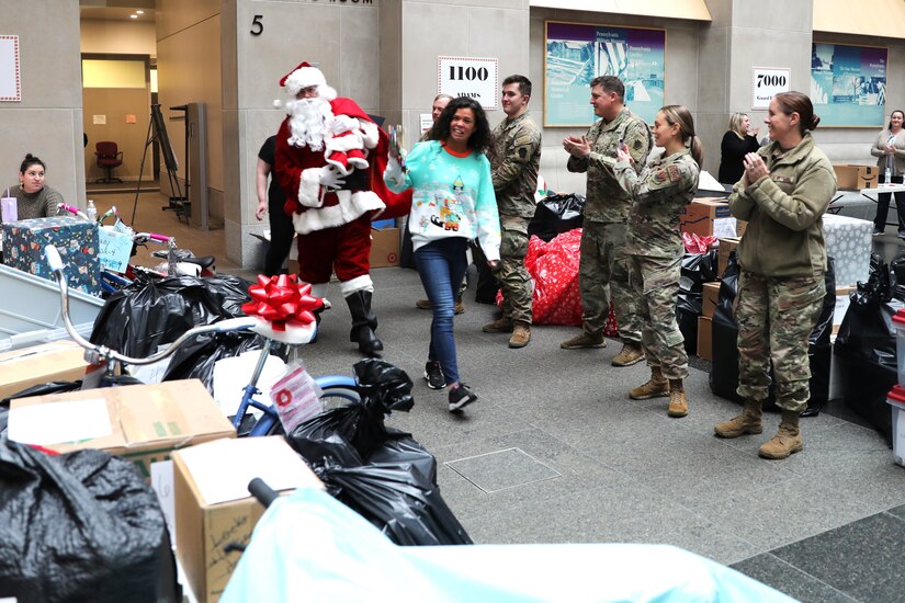 Soldiers and Airmen with the Pennsylvania National Guard team up with commonwealth employees to support the 33rd annual Holiday Wish Program Dec. 6, 2023, at the Keystone Building in Harrisburg, Pa. The Holiday Wish Program is a volunteer, donation-based program designed to provide holiday gifts to families and seniors across the commonwealth. (U.S. Army National Guard photo by Sgt. 1st Class Zane Craig)