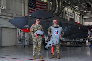 U.S. Air Force Tech. Sgt. Andrew McCamish, a 58th Aircraft Maintenance Unit aircraft section chief, and U.S. Air Force Staff Sgt. Tyler Schmitt, a 33rd Maintenance Group quality assurance inspector, developed reusable wash covers and a new canopy cover for the F-35A Lightning II at Eglin Air Force Base, Florida.