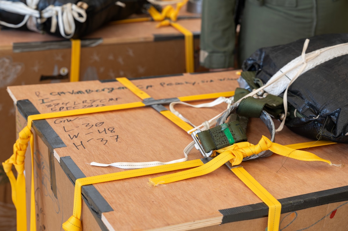 Photo of a Operation Christmas Drop bundle being rigged for airdrop