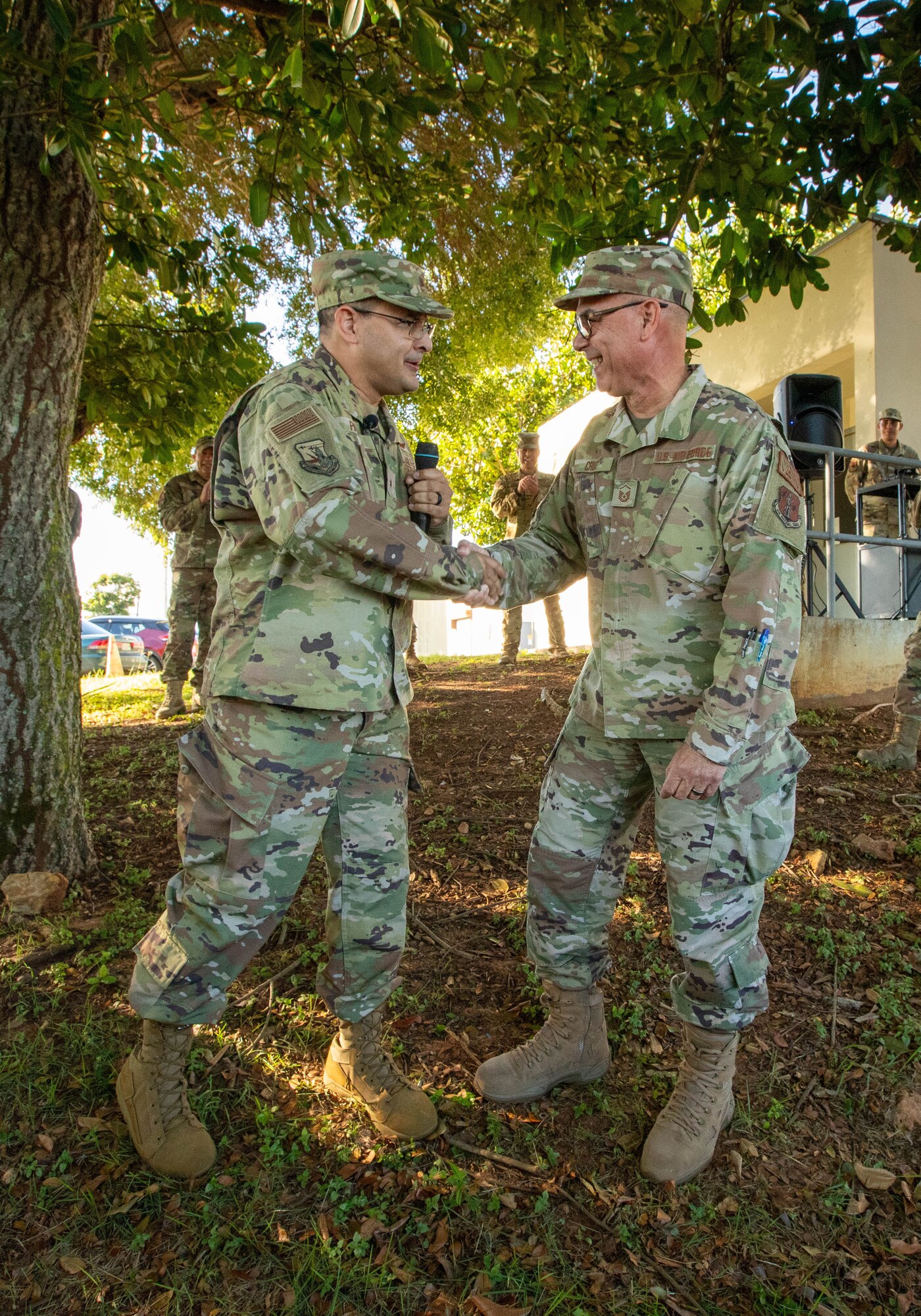 U.S. Air Force Brig. Gen. Humberto Pabon Jr., assistant adjutant general-air, Puerto Rico Air National Guard,  awards his coin of excellence to Master Sgt. Jorge Cruz, the 141st Air Control Squadron deputy operations superintendent, for his 41 years of service, Aguadilla, Puerto Rico, Oct. 15, 2023. Pabon thanked Cruz for his service commitment to the PRANG and Puerto Rico. (U.S. Air National Guard photo by Tech. Sgt. Josué Rivera)