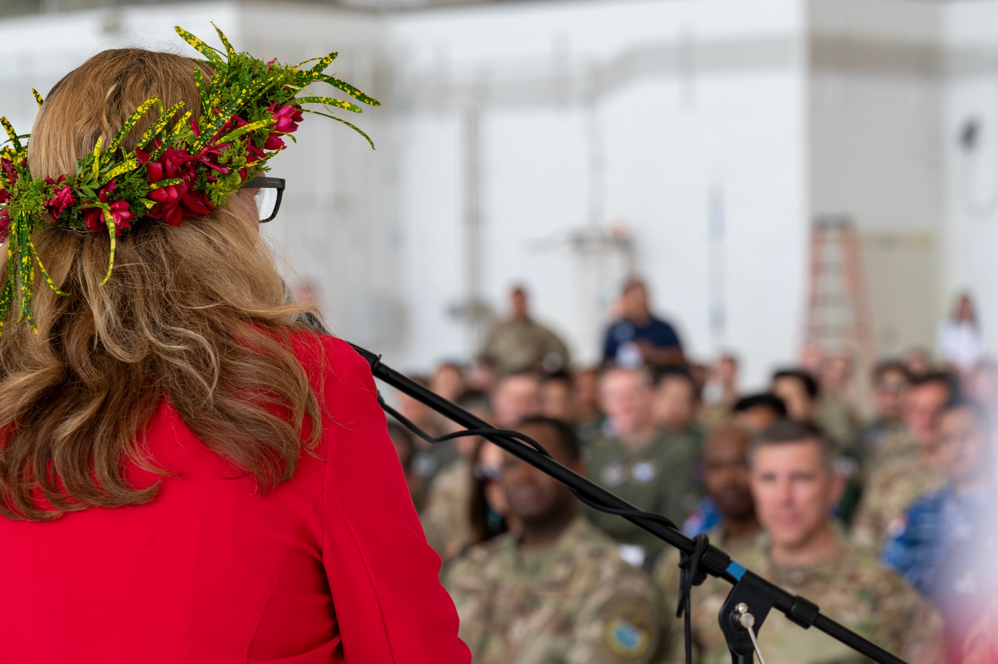 Photo of a U.S. Ambassador speaking during a ceremony for Operation Christmas Drop