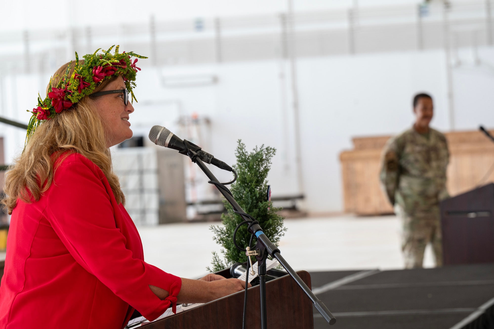 Photo of a U.S. Ambassador speaking during a ceremony for Operation Christmas Drop