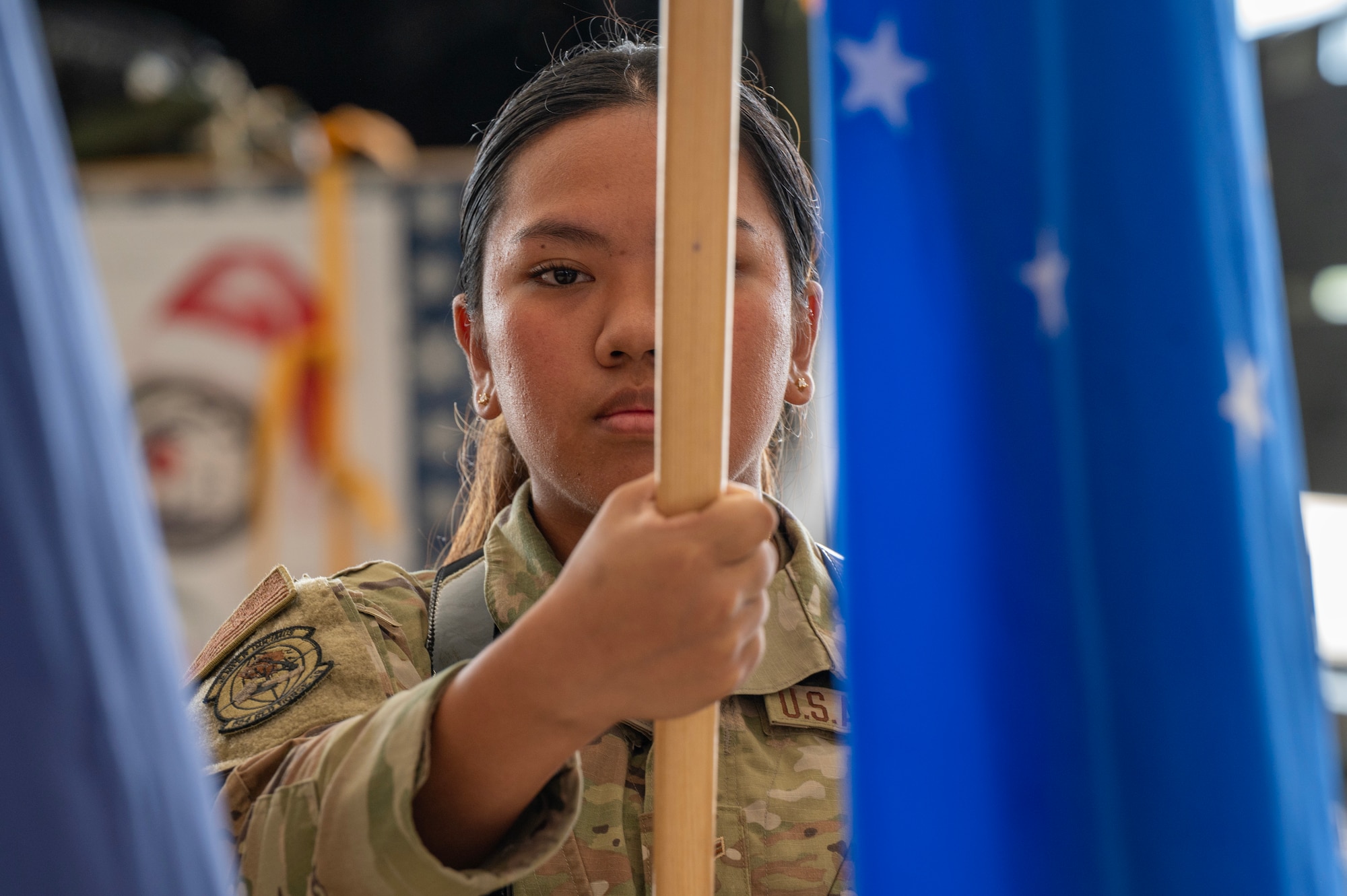 Photo of U.S. Air Force honor guardsman presenting the Air Force flag during a ceremony