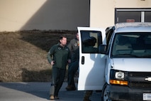 U.S. Air Force Col. Daniel Hoadley, 5th Bomb Wing commander, runs an alert vehicle readiness exercise at Minot Air Force Base, North Dakota, Dec. 6, 2023. The competition tested their speed, teamwork, and efficiency as part of a deterrence scenario.
