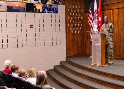 Maj. Gen. Rodney Boyd, Assistant Adjutant General – Army, Illinois National Guard, thanks the family of Col. Gregory Settle, of Effingham, Illinois, during Settle’s promotion ceremony.