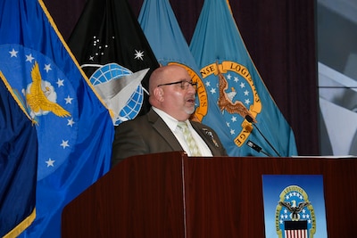 Man speaking at podium