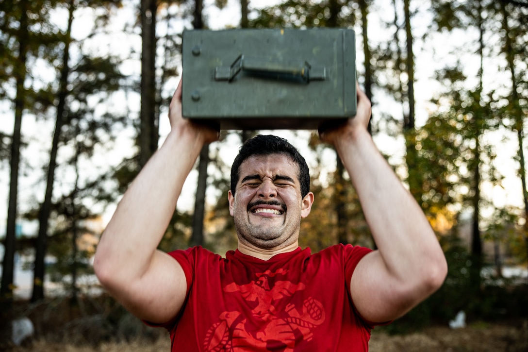 A poolee with Recruiting Substation Cary, Recruiting Station Raleigh repetitively lifts ammo can during a physical training session at Cary, North Carolina, Nov. 20, 2023. Recruiting Substations regularly conduct physical training sessions with poolees to prepare them for the physical and mental rigors of Marine Corps recruit training. (U.S. Marine Corps photo by Sgt. Brandon Salas)