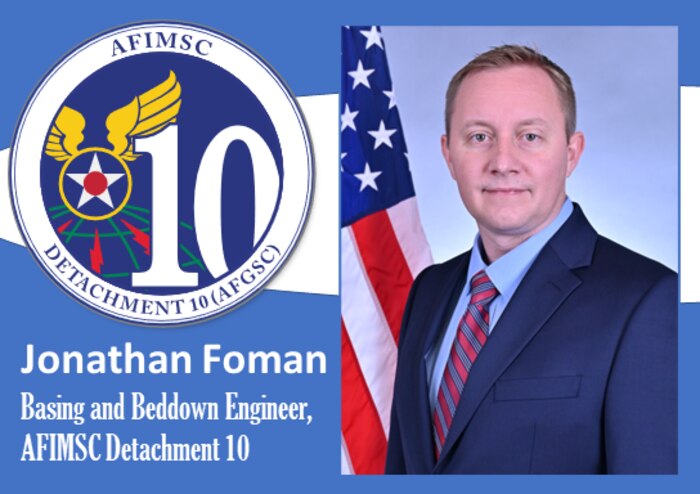 Official photo of Foman with Det 10 shield