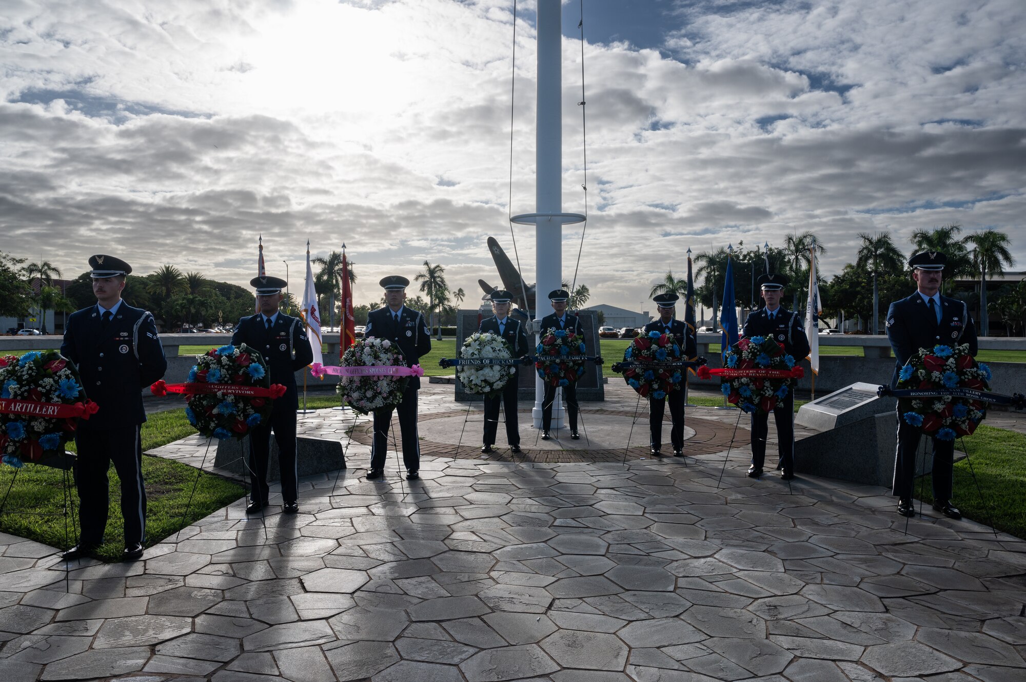Airmen assigned to the 647th Force Support Squadron honor guard stand at parade rest during a December 7th Remembrance Ceremony at Joint Base Pearl Harbor-Hickam, Hawaii, Dec. 7, 2023. This year marked the 82nd anniversary of the attacks on Pearl Harbor and Hickam Field. (U.S. Air Force photo by Staff Sgt. Alan Ricker)