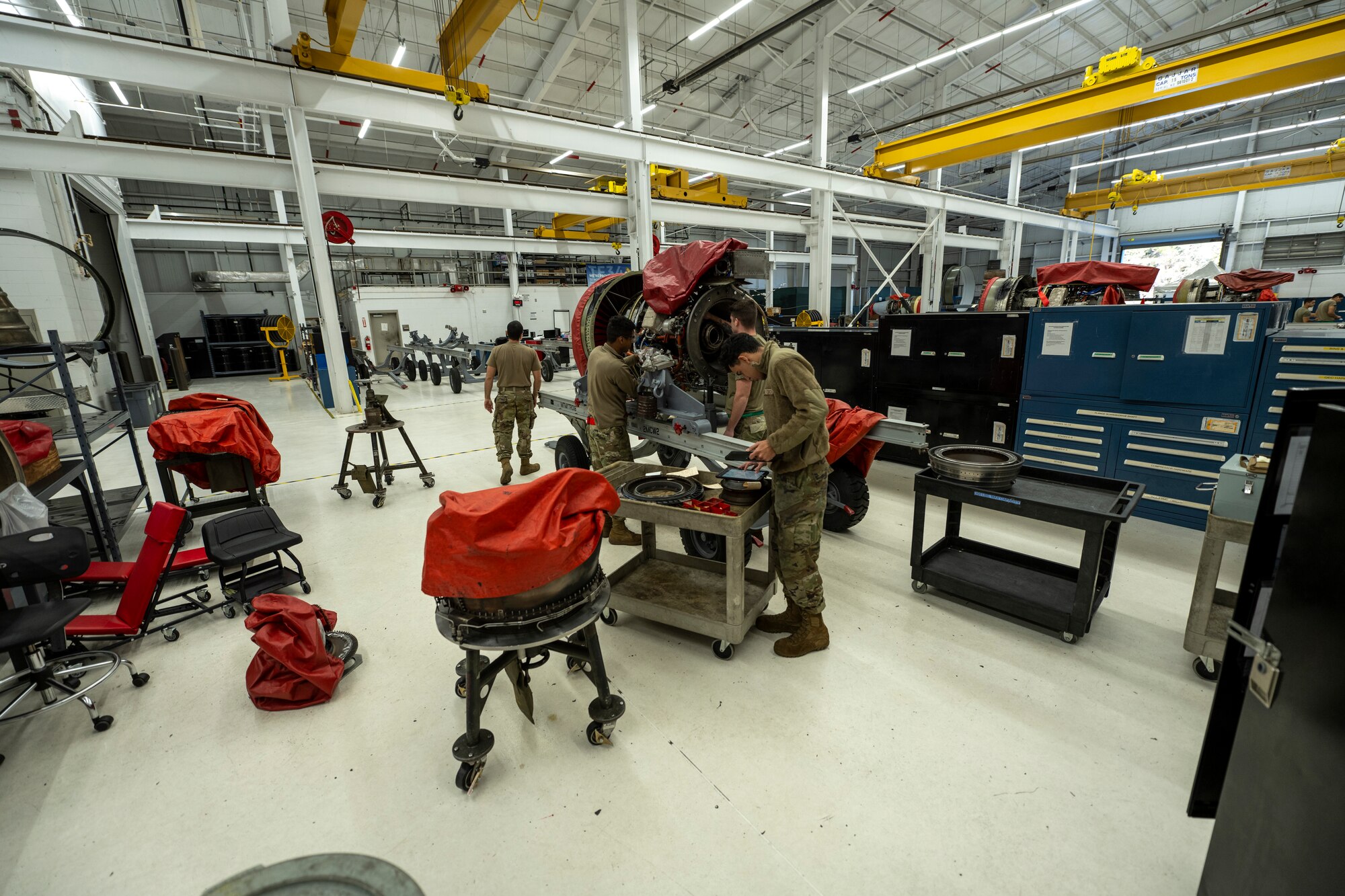 A photo of a warehouse that Airmen work in to maintain aircraft engines.