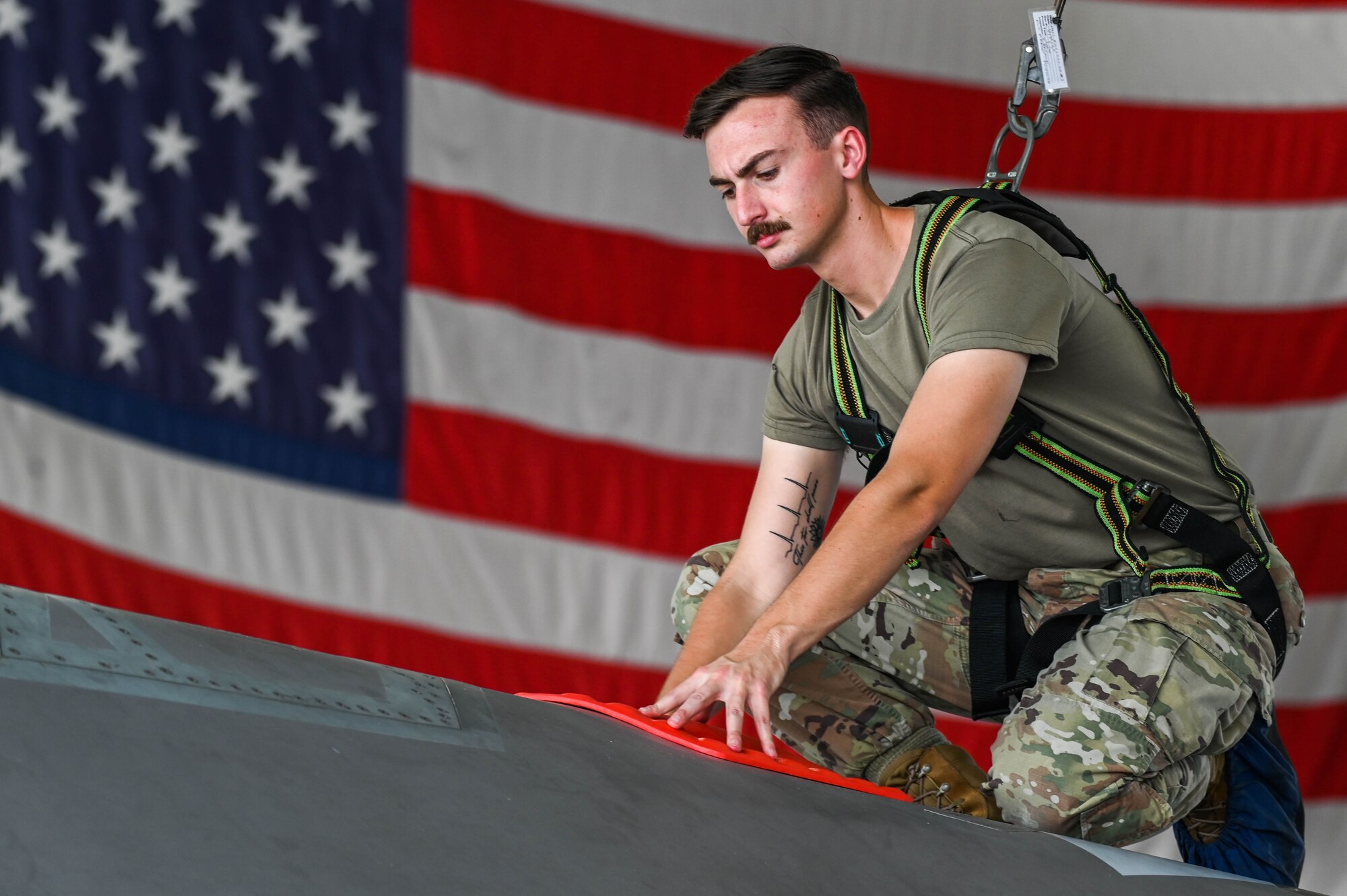 U.S. Air Force Tech. Sgt. Andrew McCamish, a 58th Aircraft Maintenance Unit aircraft section chief, and U.S. Air Force Staff Sgt. Tyler Schmitt, a 33rd Maintenance Group quality assurance inspector, developed reusable wash covers and a new canopy cover for the F-35A Lightning II at Eglin Air Force Base, Florida.