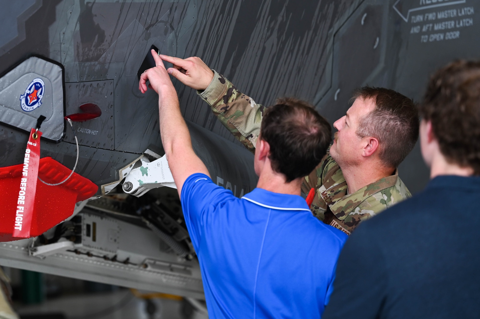 U.S. Air Force Tech. Sgt. Andrew McCamish, a 58th Aircraft Maintenance Unit aircraft section chief, and U.S. Air Force Staff Sgt. Tyler Schmitt, a 33rd Maintenance Group quality assurance inspector, developed reusable wash covers and a new canopy cover for the F-35A Lightning II at Eglin Air Force Base, Florida.