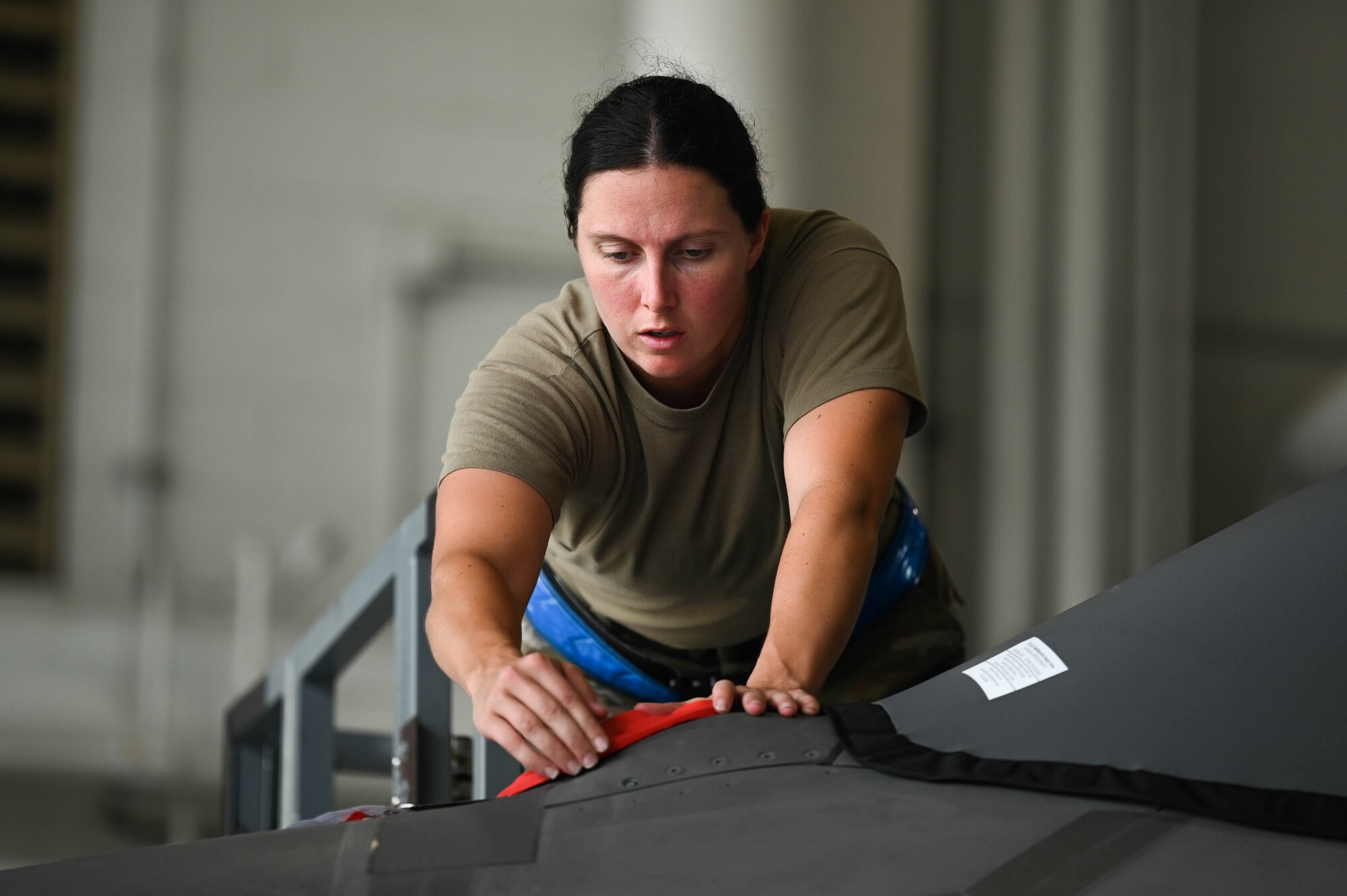 U.S. Air Force Tech. Sgt. Andrew McCamish, a 58th Aircraft Maintenance Unit aircraft section chief, and U.S. Air Force Staff Sgt. Tyler Schmitt, a 33rd Maintenance Group quality assurance inspector, developed reusable wash covers and a new canopy cover for the F-35A Lightning II at Eglin Air Force Base, Florida.