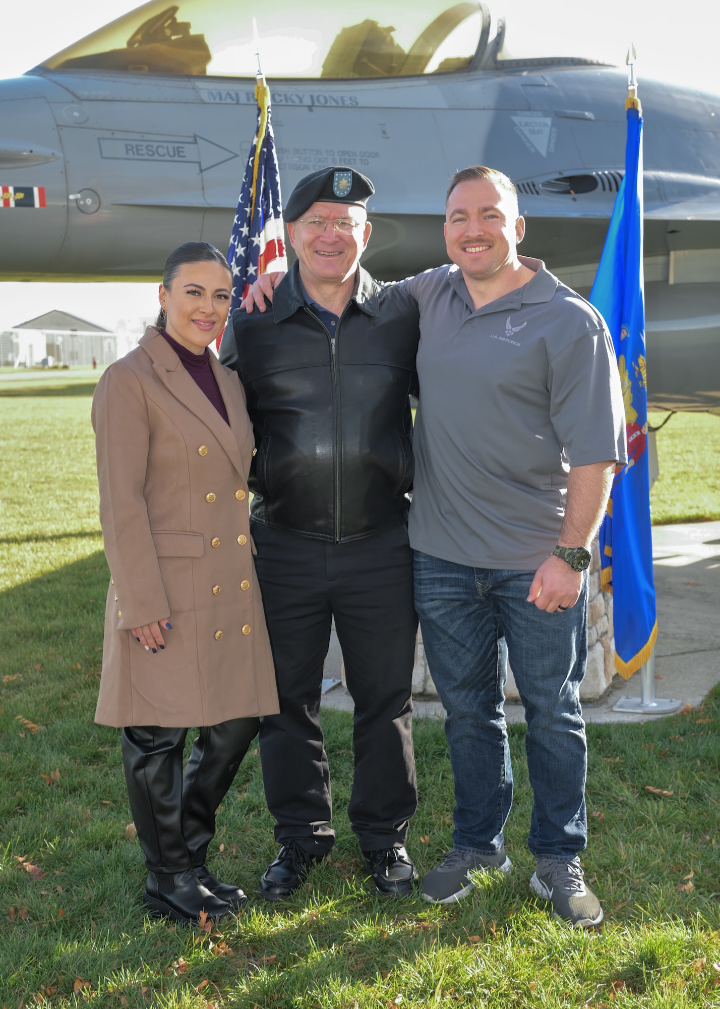 A family takes a photo after husband and wife enlist.