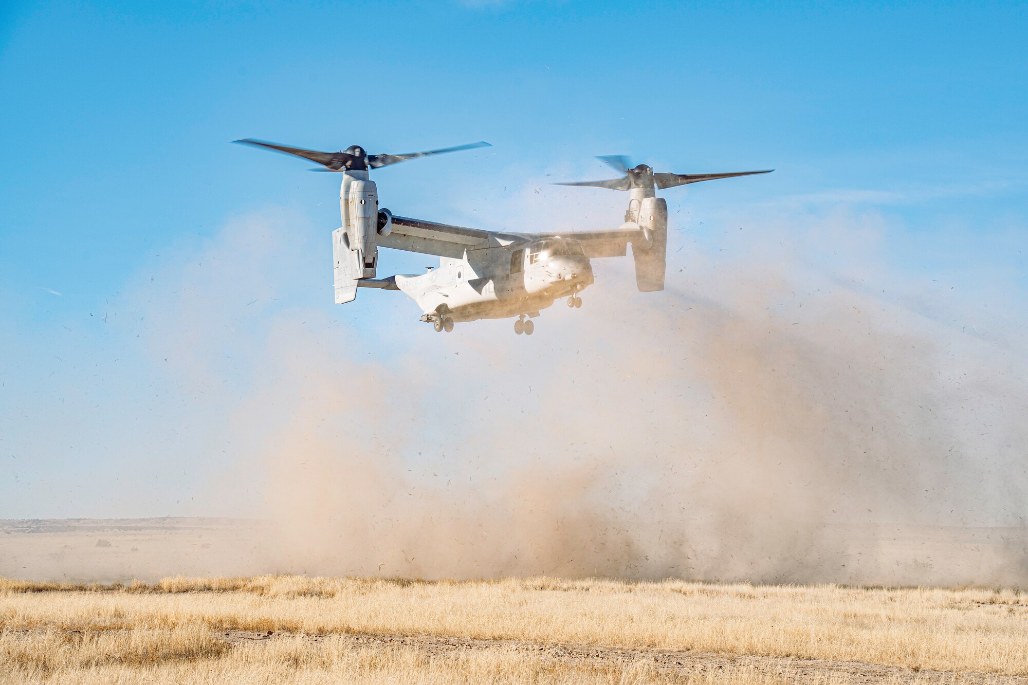 Helicopter landing in an open field.