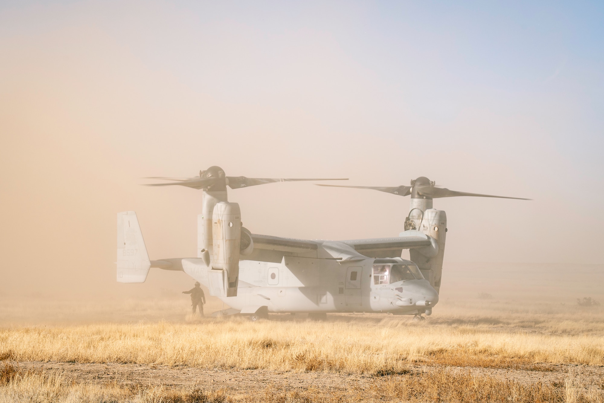 Helicopter landing in a field.