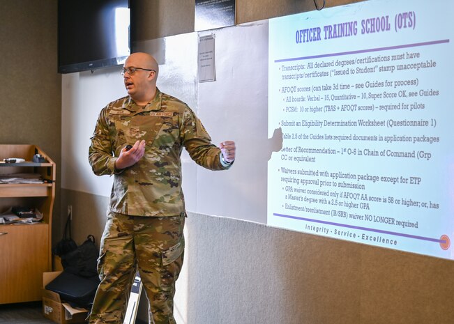 U.S. Air Force Master Sgt. Bond Aulik, 30th Force Support Squadron development advisor, provides information to Airman and Guardians on methods to commission and how to start the process of becoming an officer during American Education Week.