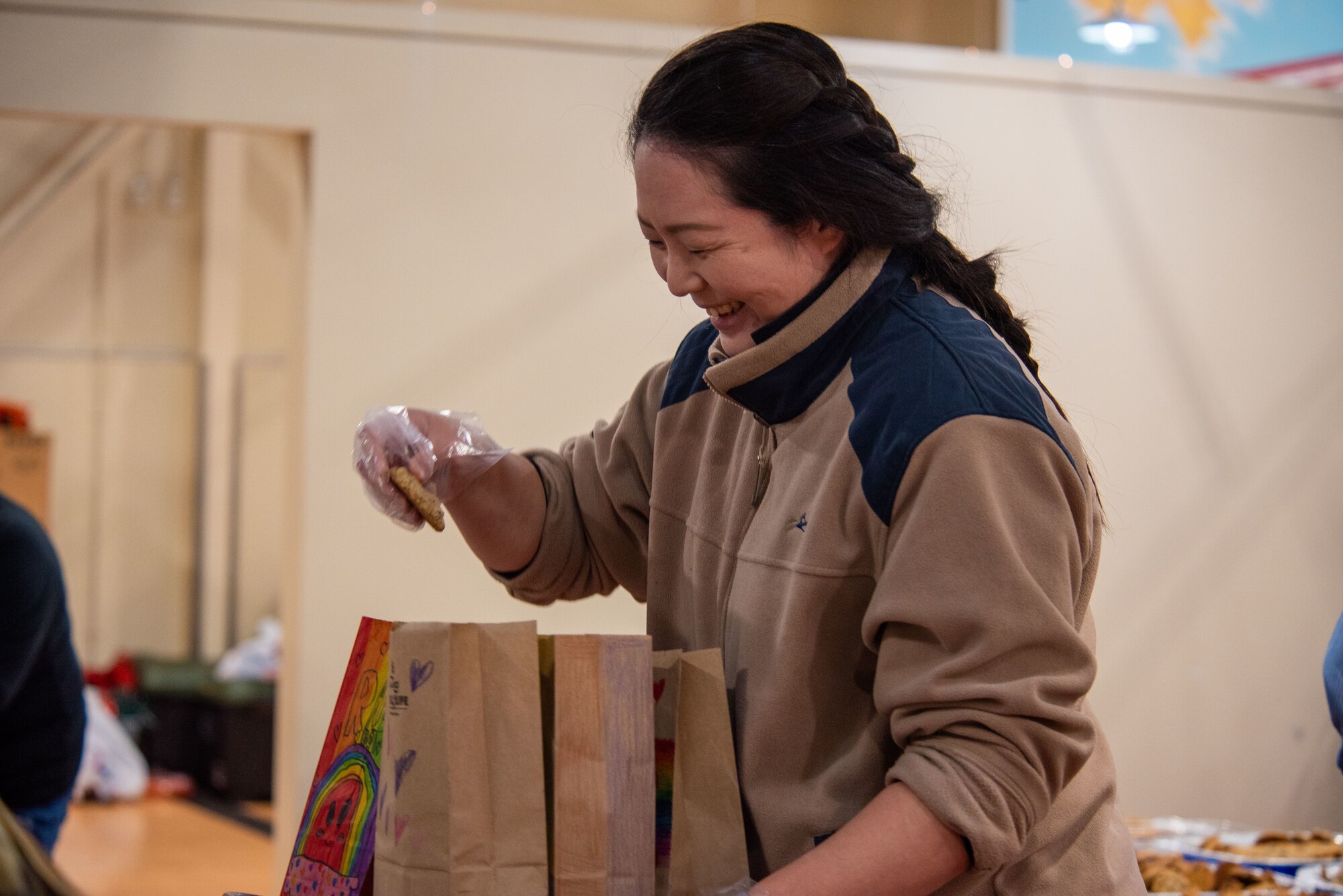 A member of Team Misawa bags cookies during the annual Cookie Caper at Misawa Air Base, Japan, Dec. 5, 2023.