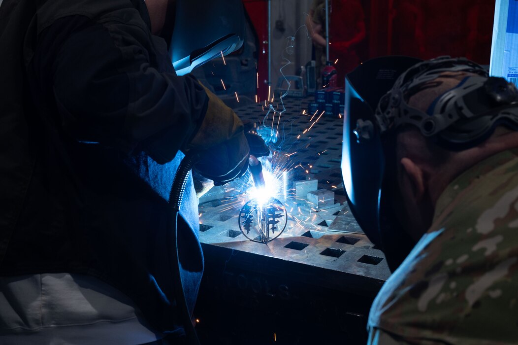 A U.S. Air Force spouse welds an ornament on Eielson Air Force Base, Alaska, Dec. 4, 2023.