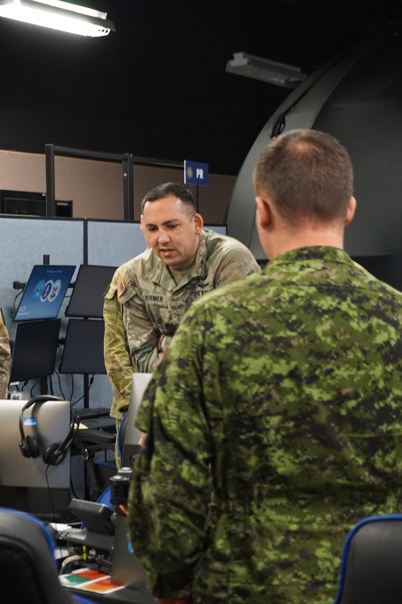 uniformed military members working at computers