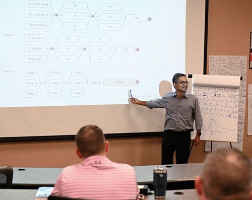Goldratt consultant, Sridharan Chandrasekaran, stands in front of ToC class.