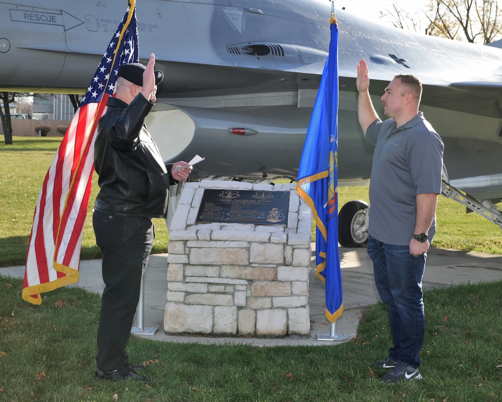 An enlistment is held at the 115th Fighter Wing