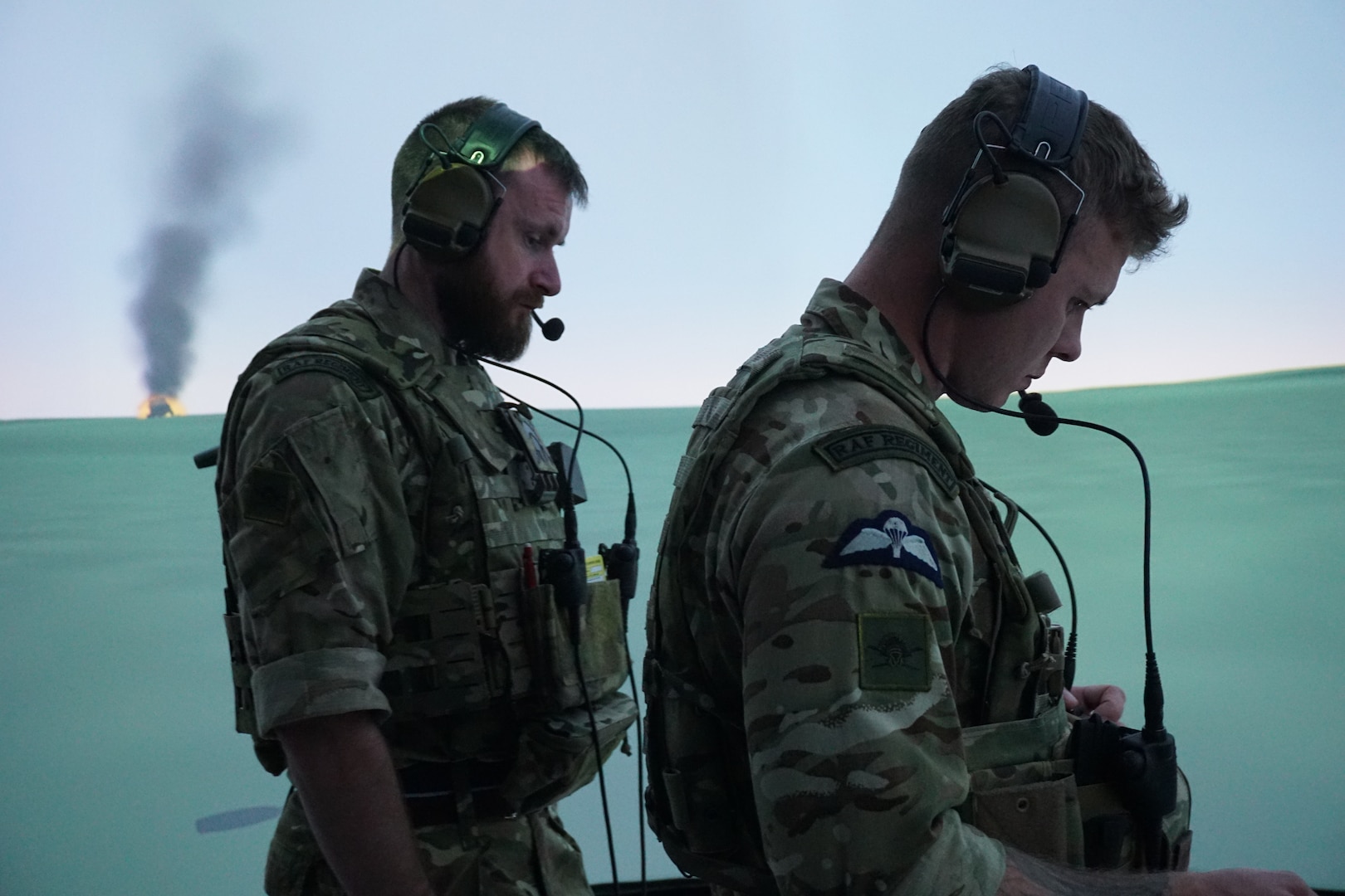 uniformed coalition forces work in a virtual simulated environment