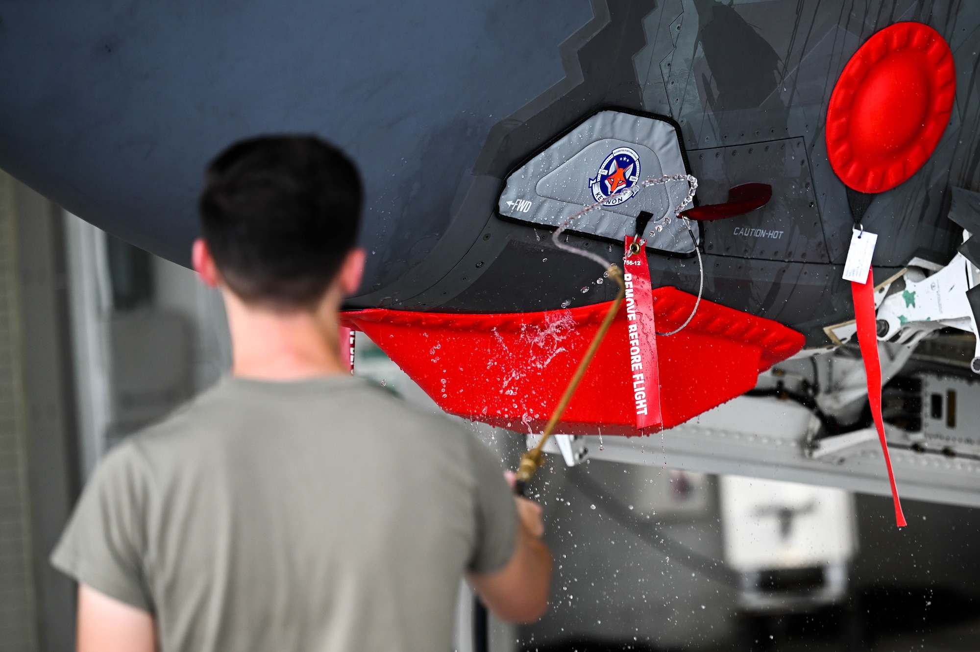 U.S. Air Force Tech. Sgt. Andrew McCamish, a 58th Aircraft Maintenance Unit aircraft section chief, and U.S. Air Force Staff Sgt. Tyler Schmitt, a 33rd Maintenance Group quality assurance inspector, developed reusable wash covers and a new canopy cover for the F-35A Lightning II at Eglin Air Force Base, Florida.