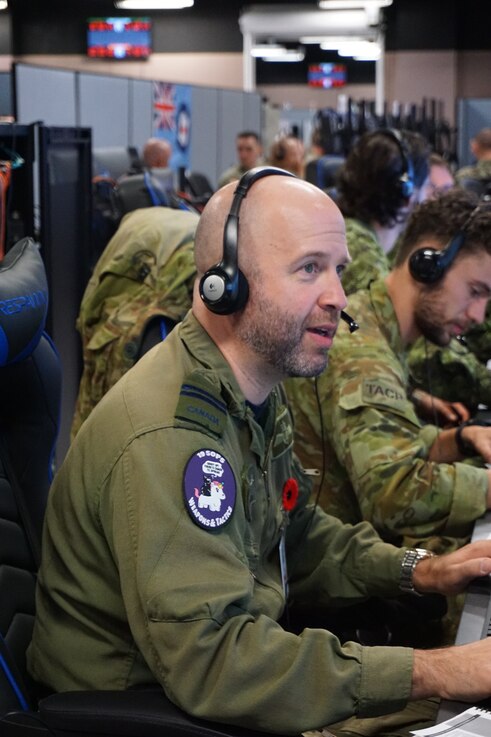  uniformed Royal Canadian military members working at computers