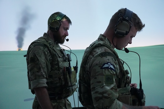  uniformed coalition forces work in a virtual simulated environment