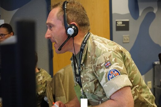  military member working at computers