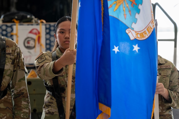 Photo of USAF honor guardsman presenting the Air Force flag during a ceremony